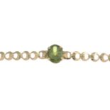 A 9ct gold peridot bracelet.Hallmarks for Birmingham, 1963.Length 16.5cms.