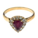 A ruby and diamond cluster ring.Estimated total diamond weight 0.40ct.