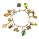 A charm bracelet, suspending thirteen charms.Some with marks to indicate 9ct gold.