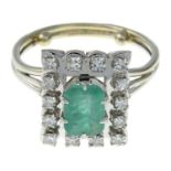 An emerald and single-cut diamond cluster ring.Emerald calculated weight 0.94ct,