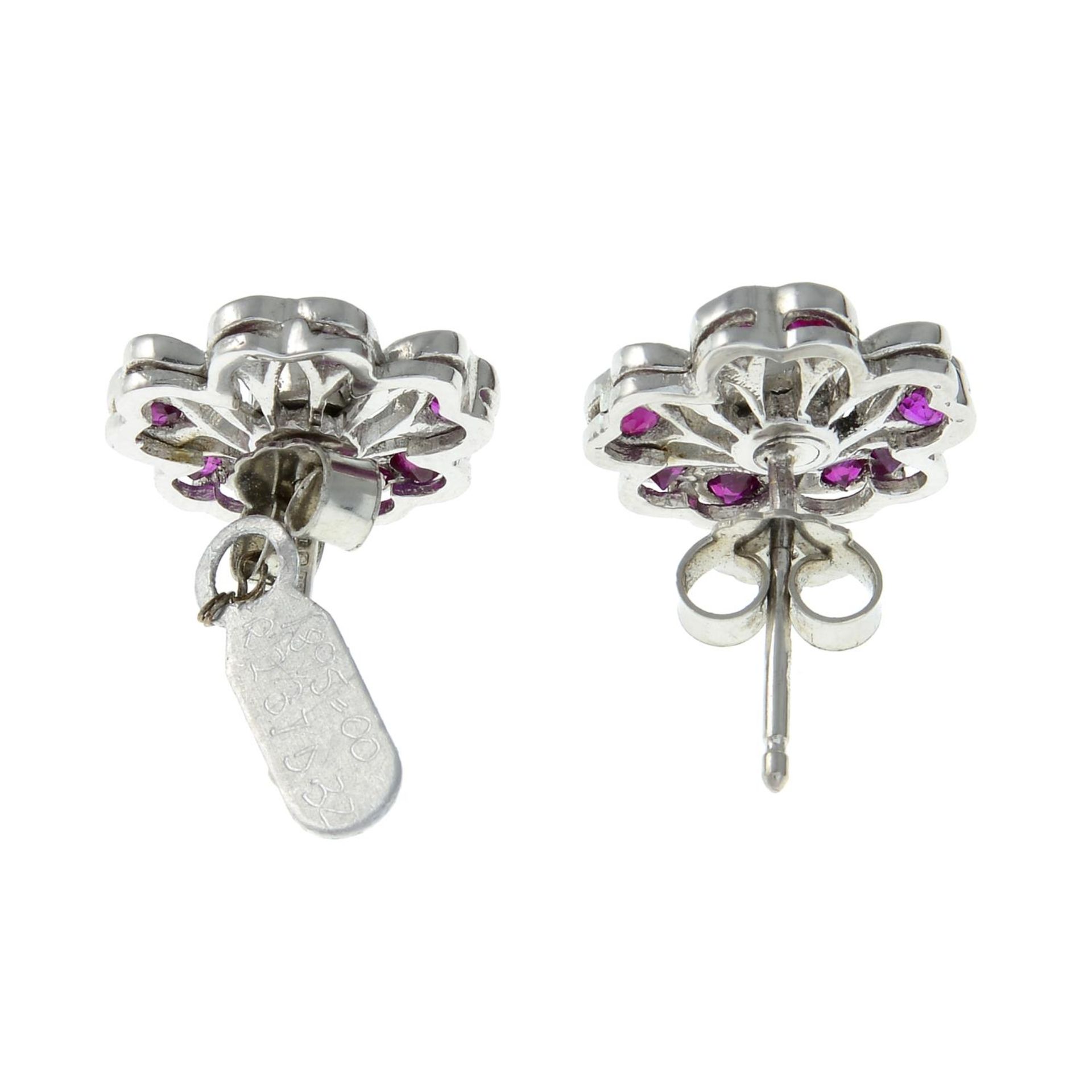 A pair of platinum diamond and ruby floral cluster earrings.Estimated total diamond weight 0.30ct, - Image 2 of 2