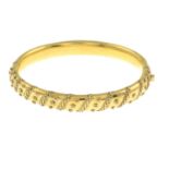 A late 19th century 15ct gold bangle, with cannatille detail.Stamped 15.