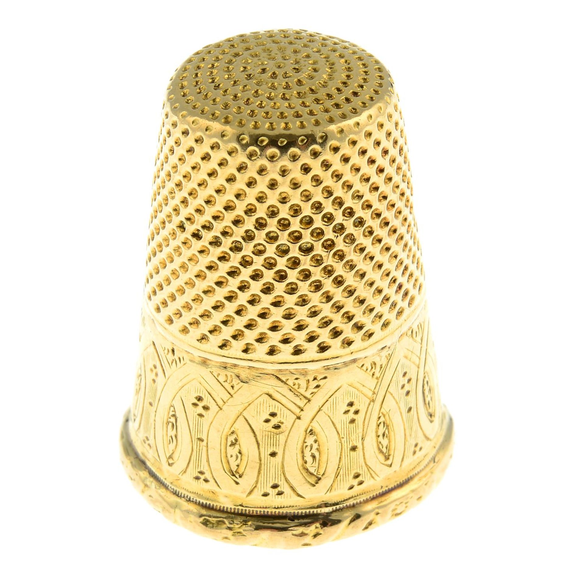 An early 20th century gold thimble.Length 2.5cms.