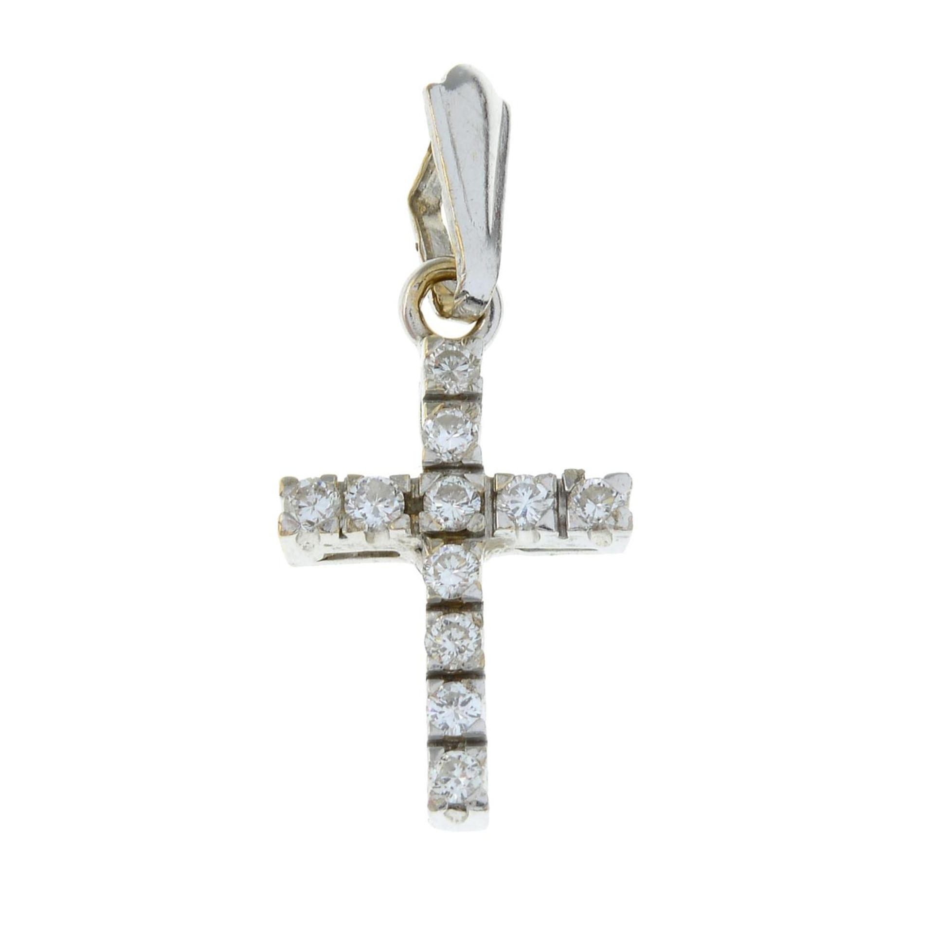 An 18ct gold diamond cross pendant.Estimated total diamond weight 0.20ct.