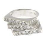 A cubic zirconia dress ring.Stamped 750, Cypriot marks.Ring size P1/2.