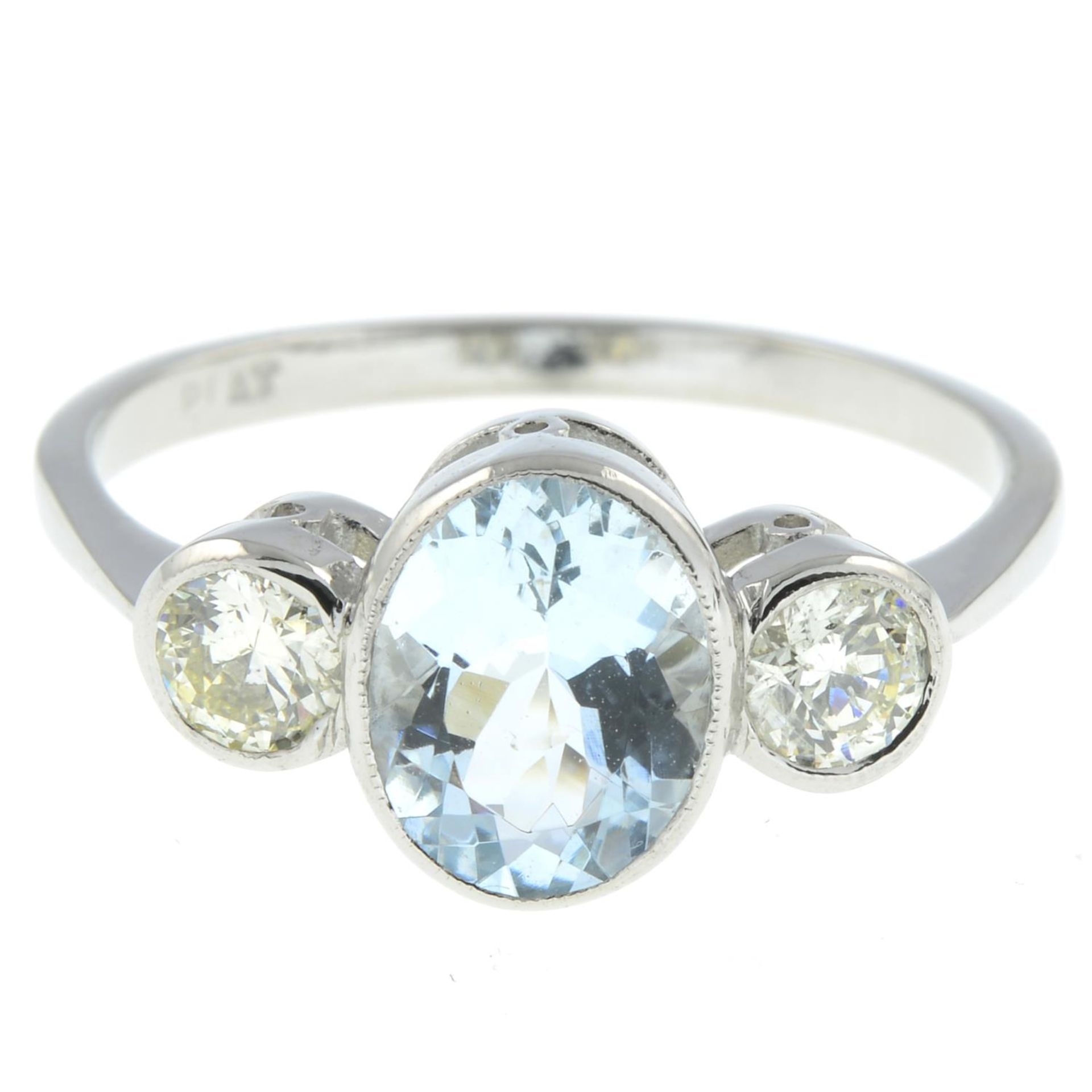An aquamarine and brilliant-cut diamond three-stone ring.Aquamarine weight 1.30ct.