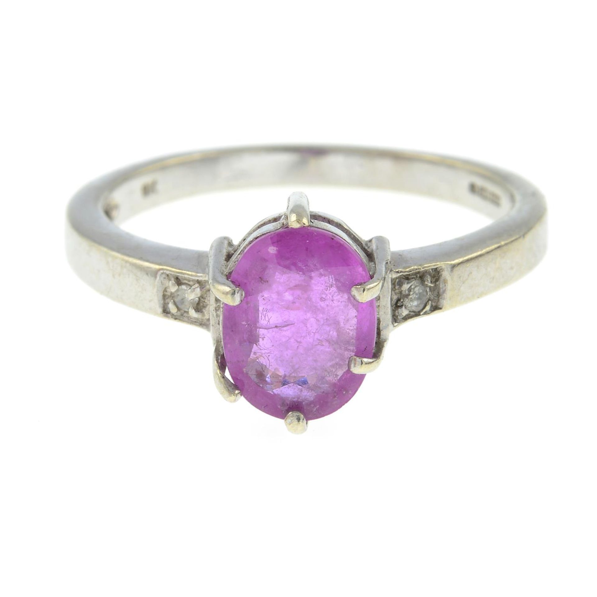 A 9ct gold pink sapphire and diamond ring.Hallmarks for 9ct gold.