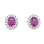 An 18ct gold ruby and diamond cluster earrings.Estimated total diamond weight 0.10ct.