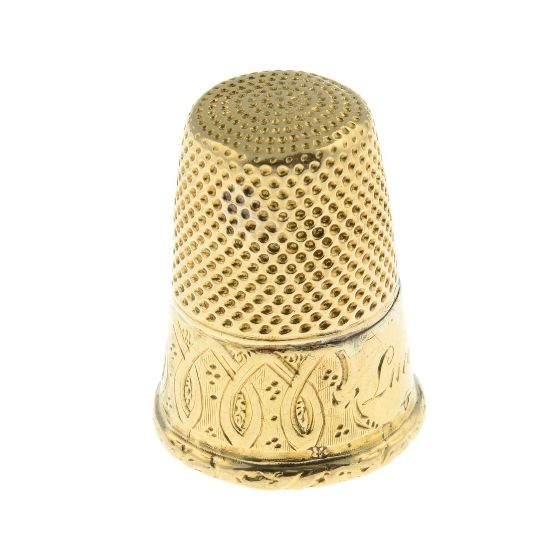 An early 20th century gold thimble.Length 2.5cms. - Image 2 of 3
