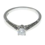 An 18ct gold brilliant-cut diamond ring.Total diamond weight 0.40ct, stamped to band.