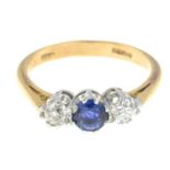 An 18ct gold sapphire and diamond three-stone ring.Estimated total diamond weight 0.30ct,