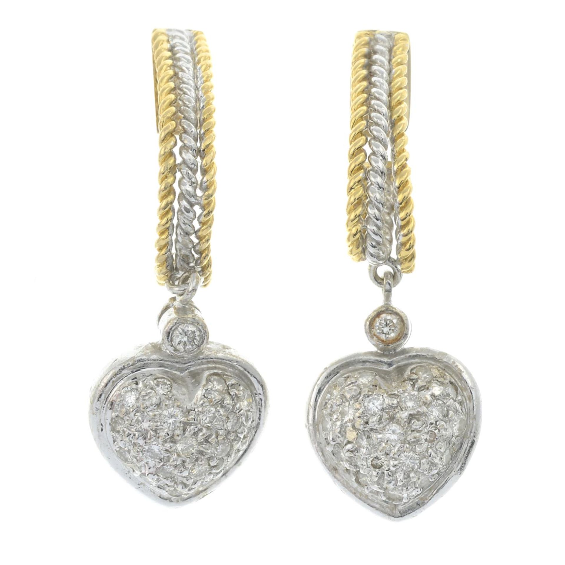 A pair of diamond heart drop bi-colour earrings.Estimated total diamond weight 0.20ct.Length