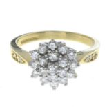 An 18ct gold diamond cluster ring.Estimated total diamond weight 0.70ct.