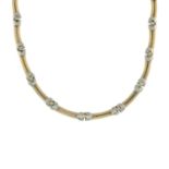 A 9ct gold bi-colour necklace.Hallmarks for 9ct gold.