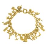 A 9ct gold charm bracelet.Bracelet with hallmarks for Sheffield.Length 19cms.