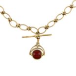 An Albert, suspending a 9ct gold T-bar and a 9ct gold onyx and carnelian swivel fob.May be worn as