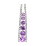 A diamond and pink sapphire pendant.Total pink sapphire weight 0.77ct,