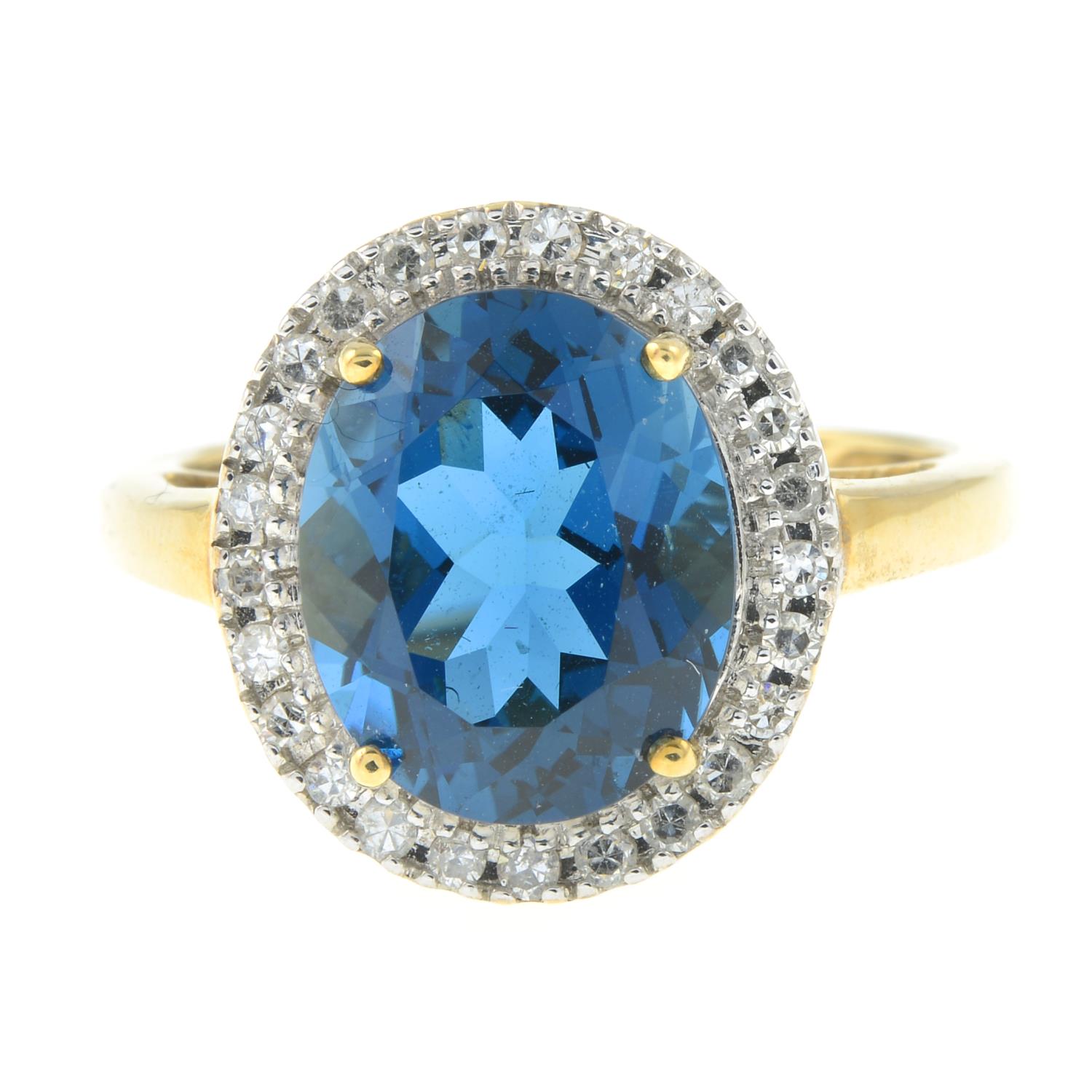 A 9ct gold blue topaz and single-cut diamond cluster ring.Estimated total diamond weight 0.20ct.
