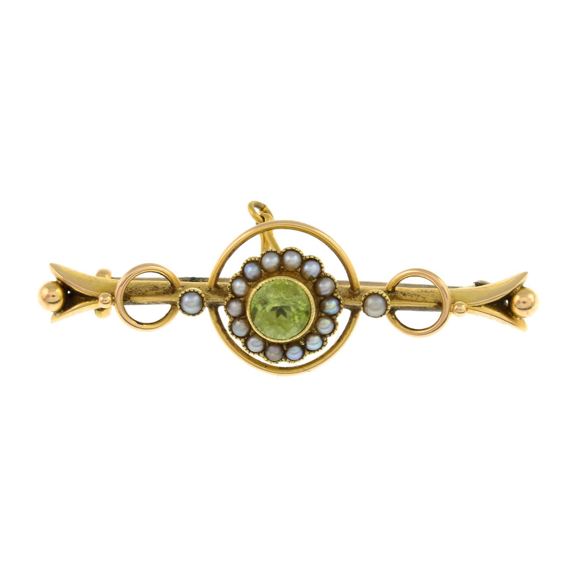 An early 20th century 15ct gold peridot and split pearl brooch.