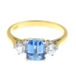 An 18ct gold aquamarine and diamond three-stone ring.Estimated total diamond weight 0.30ct,