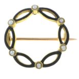 An early 20th century 15ct gold split pearl and black enamel wreath brooch.Stamped 15ct.Diameter