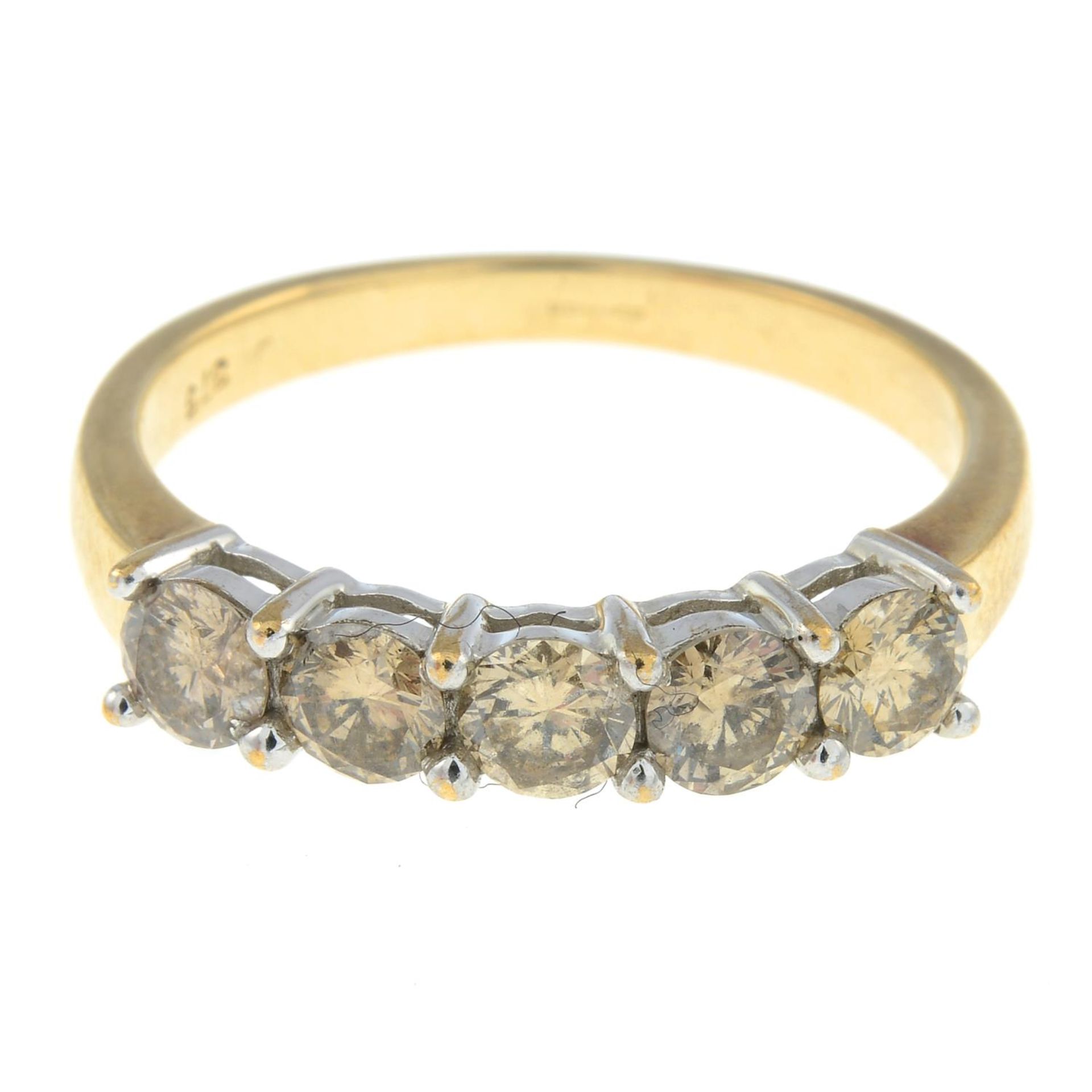 A 9ct gold diamond five-stone ring.Estimated total diamond weight 1ct, tinted colour, P1 clarity.
