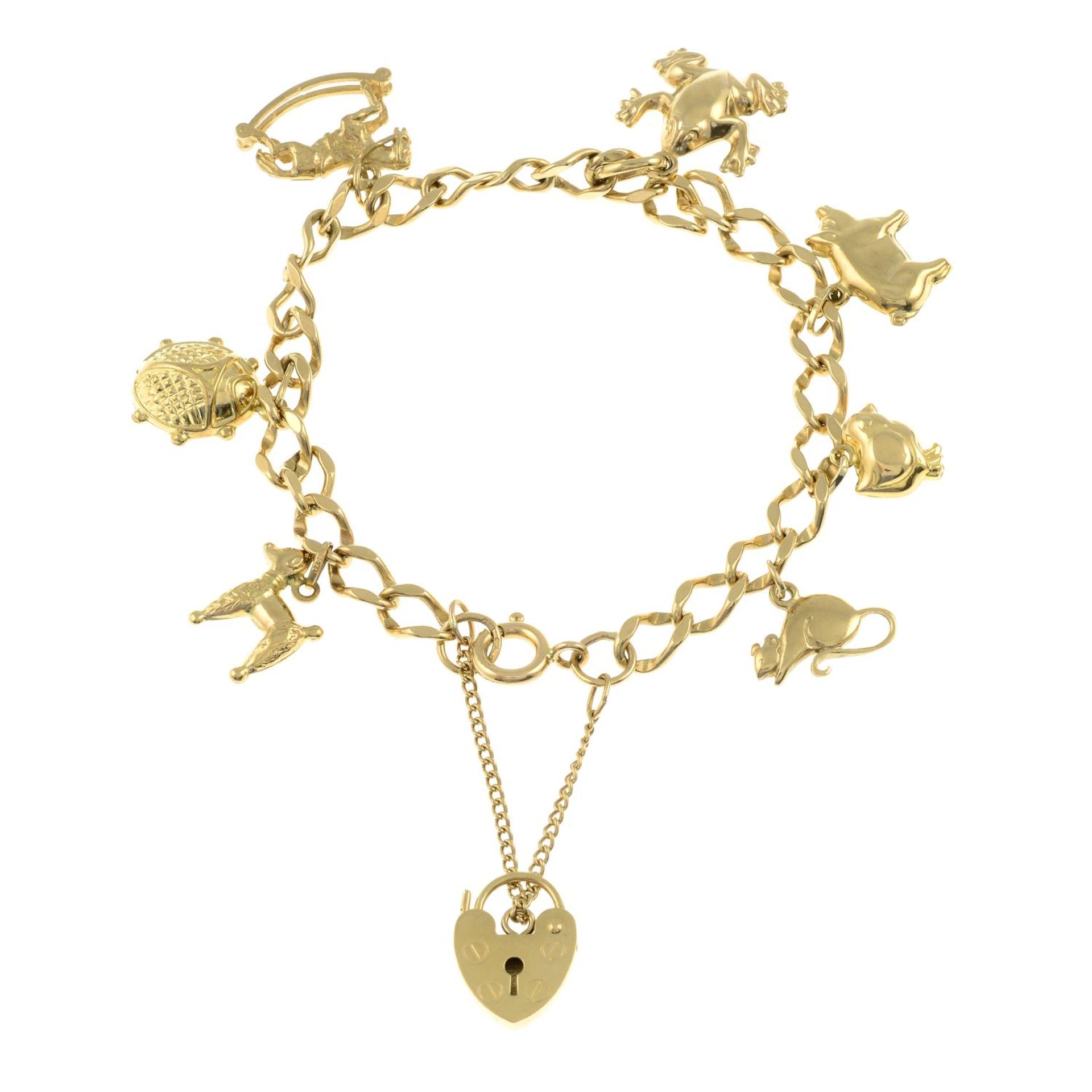 A 9ct gold charm bracelet.Hallmarks for Sheffield.Length 19.4cms.