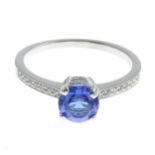 A blue paste and diamond ring.Total diamond weight 0.18ct,
