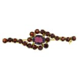 A garnet bar brooch.Stamped 333.Length 4.5cms.