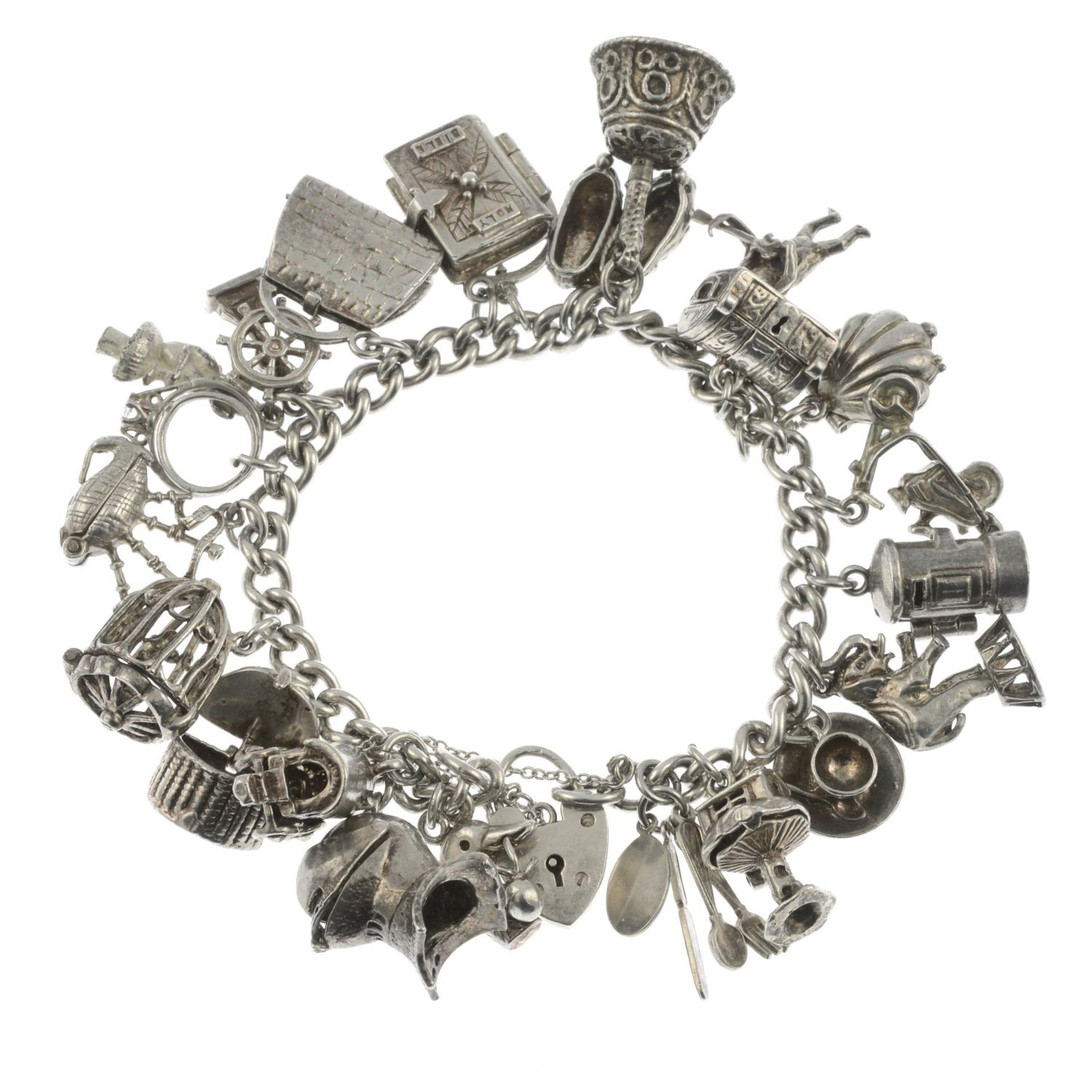 A silver charm bracelet, a further charm bracelet and assorted charms.Hallmarks for Birmingham.