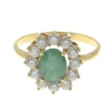 An emerald and cubic zirconia cluster ring.Ring size N.