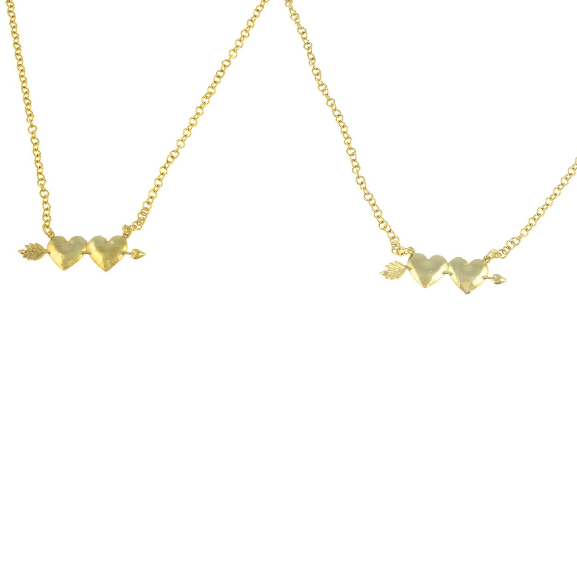 Two gold plated cupid heart necklaces and a fox pendant with chain,