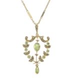 An early 20th century 9ct gold peridot and split pearl openwork pendant,