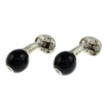 A pair of silver number 8 black enamel ball cufflinks.,