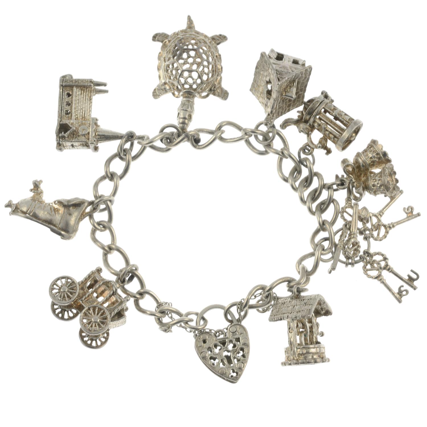 Two silver charm bracelets and assorted charms.Hallmarks for Birmingham and London.Lengths 18 and