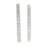 A pair of 9ct gold brilliant-cut diamond hoop earrings.