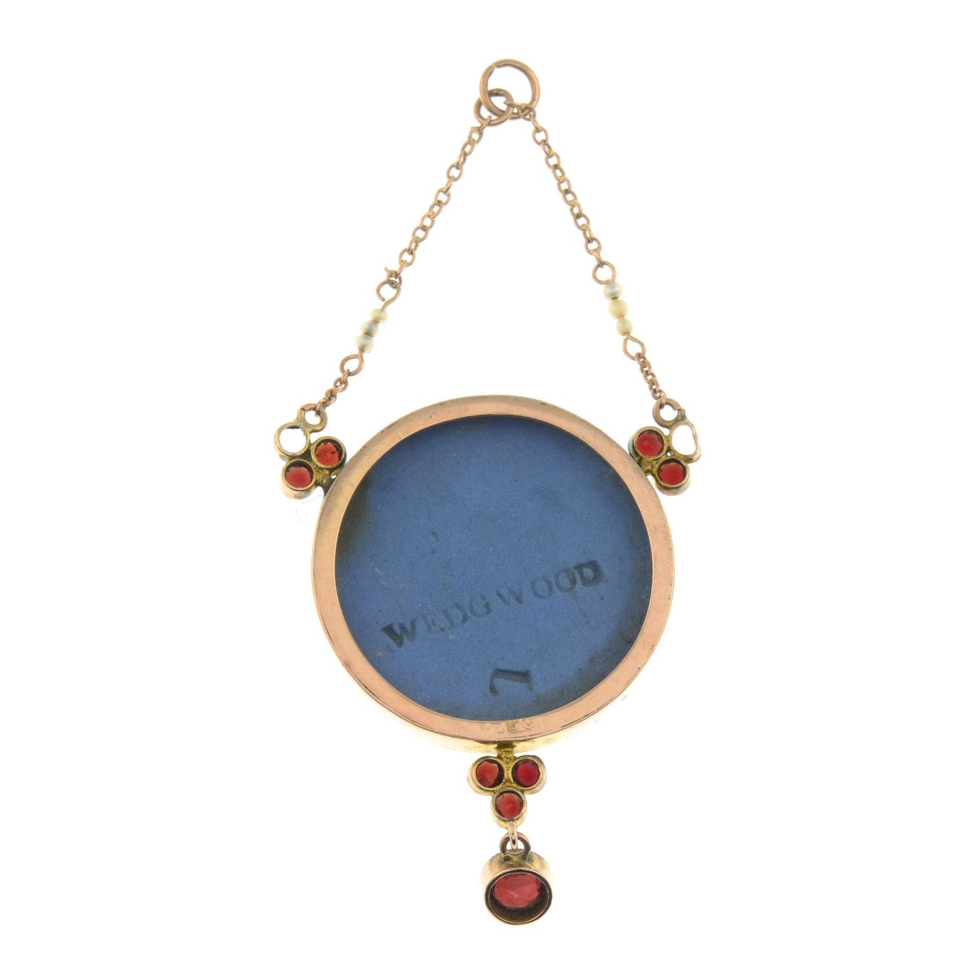 A 9ct gold Wedgwood cameo pendant with garnet and seed pearl detail.Signed Wedgwood. - Image 2 of 2
