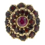 A 9ct gold garnet and synthetic ruby cluster ring.Hallmarks for 9ct gold.