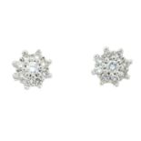 A pair of brilliant-cut diamond cluster earrings.Estimated total diamond weight 0.25ct.Length