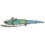 A plique-a-jour enamel grasshopper brooch with ruby and marcasite detail.stamped 925.Length 7.1cms.