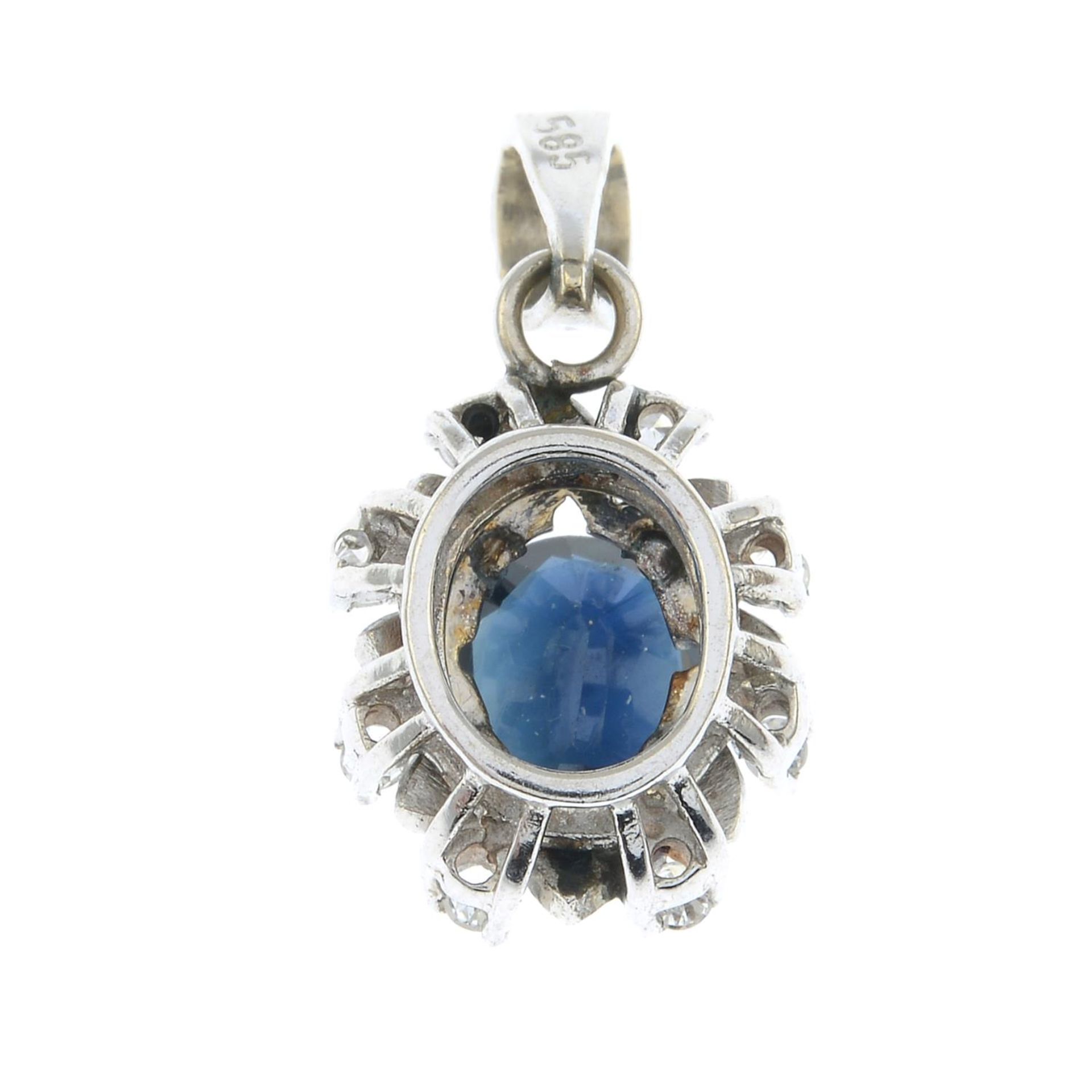 A sapphire and diamond pendant.Stamped 585.Length 1.8cms. - Image 2 of 2