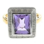 A 9ct gold amethyst and diamond cluster ring.Estimated total diamond weight 0.10ct.Hallmarks for