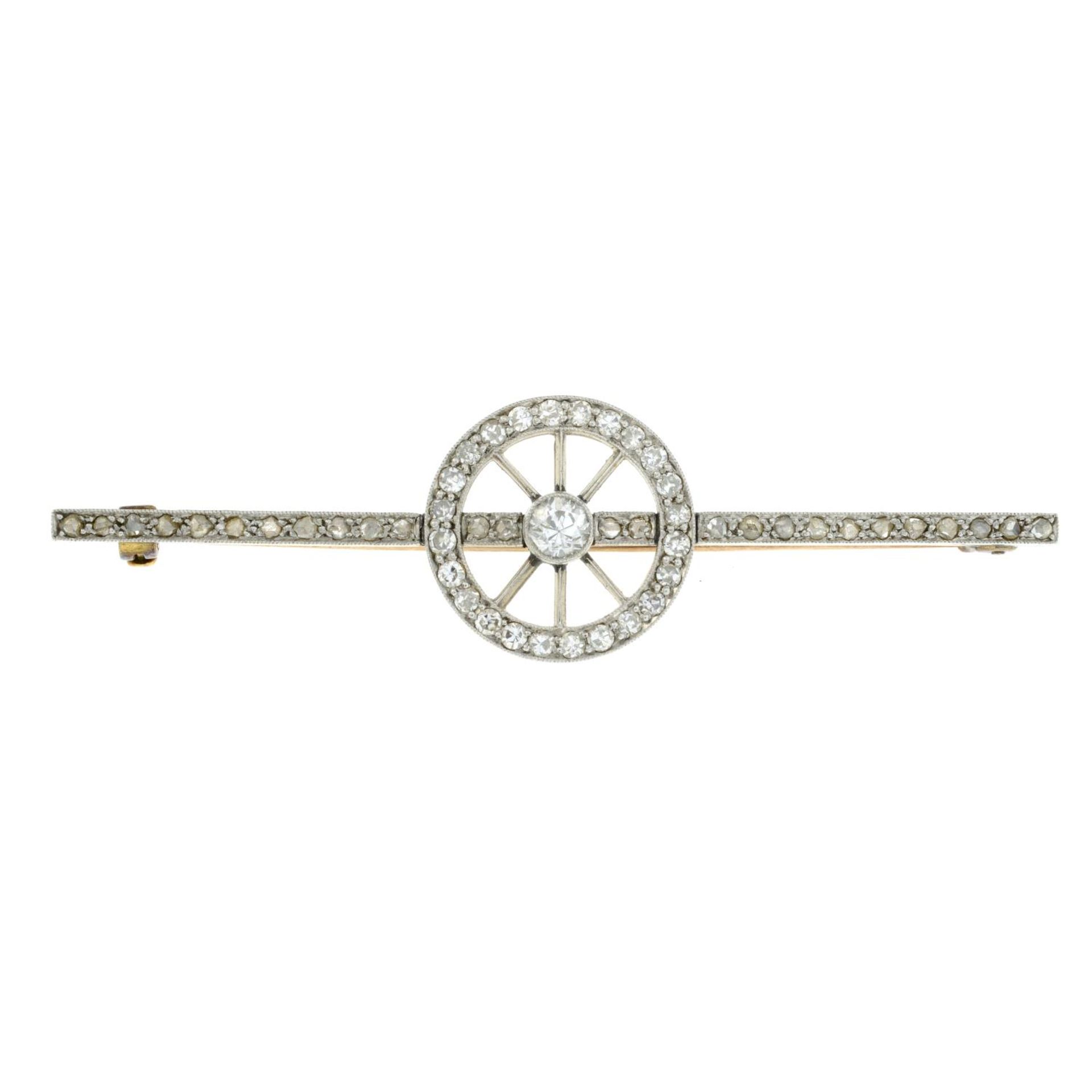 An old cut diamond eight spoke wheel brooch.Length 5.4cms.