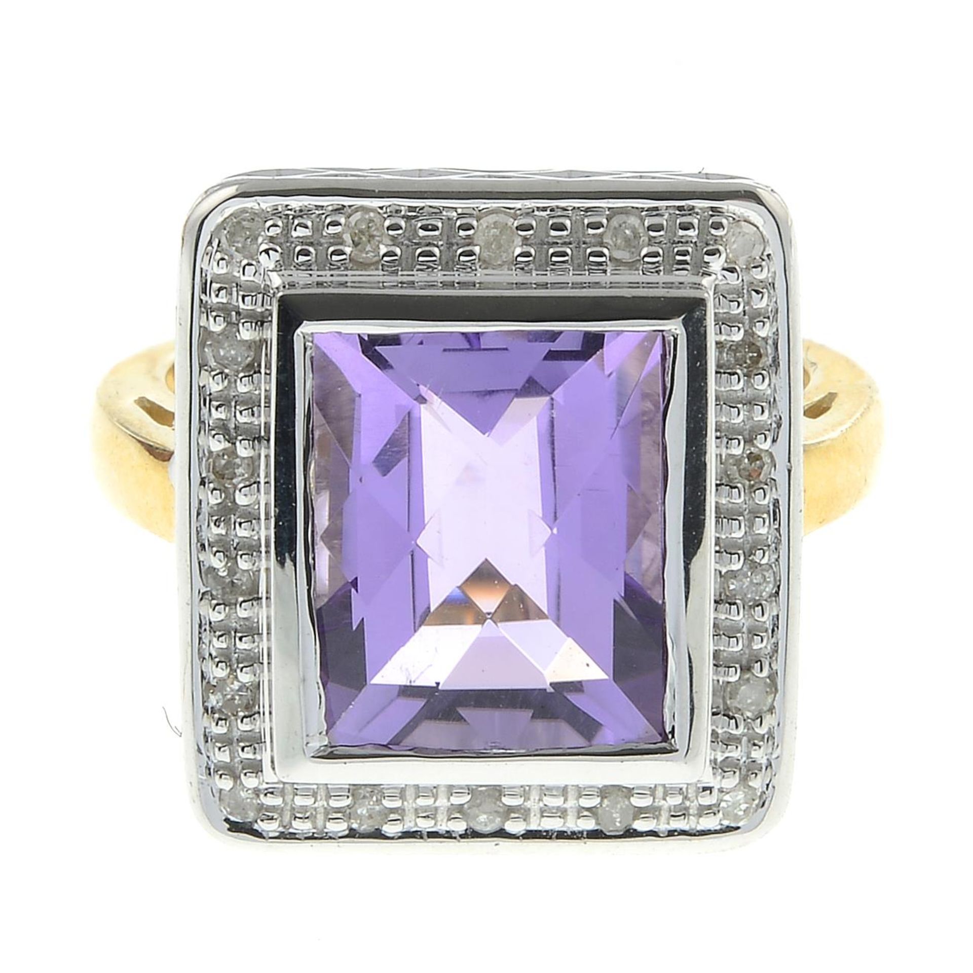 A 9ct gold amethyst and diamond cluster ring.Total diamond weight 0.10ct,