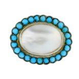 A selection of brooches, to include a turquoise and mother-of-pearl brooch.