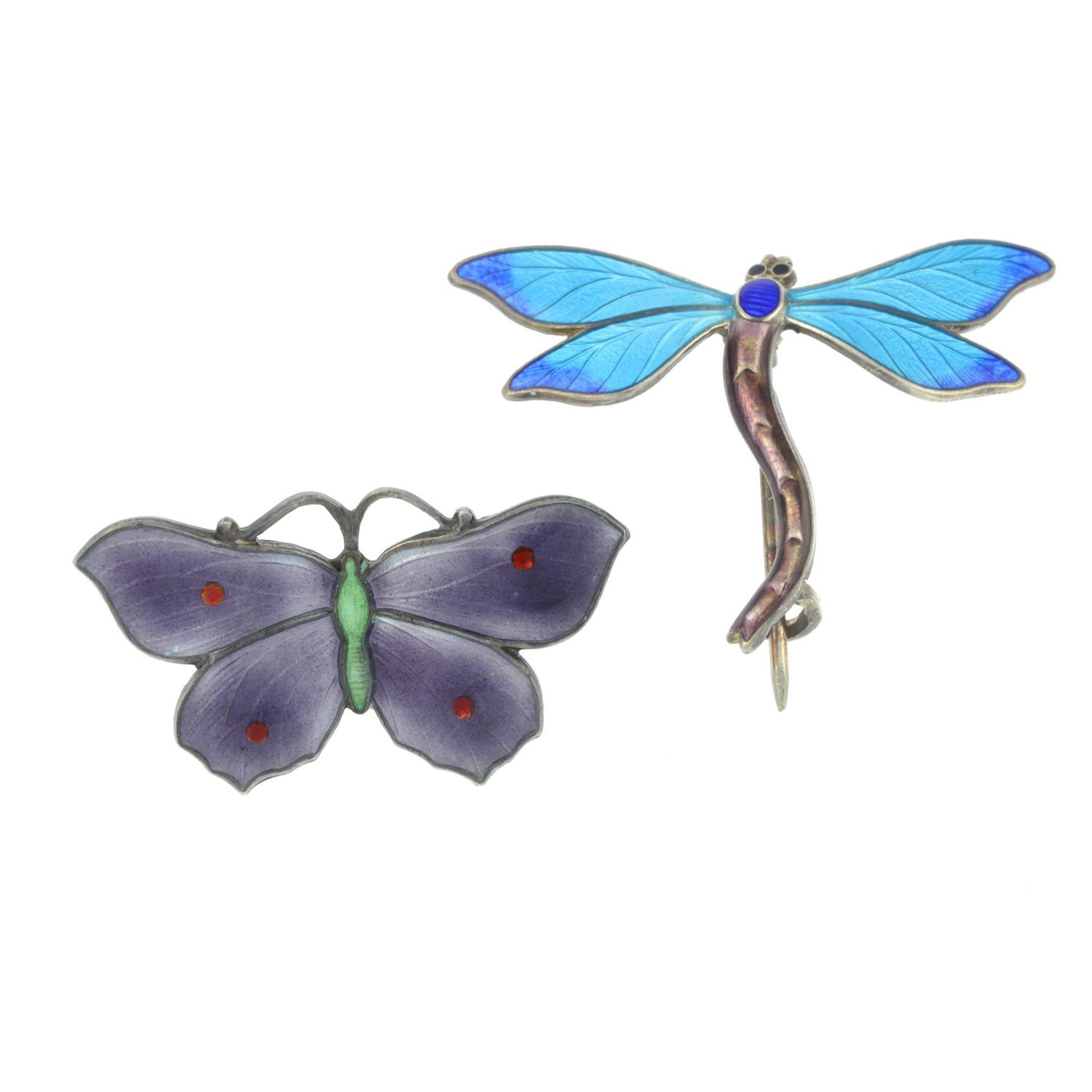 A purple enamel butterfly brooch and a blue enamel dragonfly brooch,