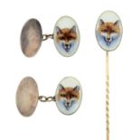 An enamel stickpin and cufflink set, depicting a fox.Stamps for silver.Length of stickpin 7cms.