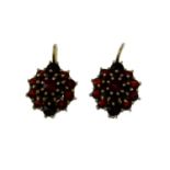 A selection of earrings, to include a pair of early 20th century garnet earrings.