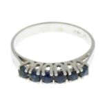 A sapphire band ring.Stamped 585 PD.Ring size K1/2.