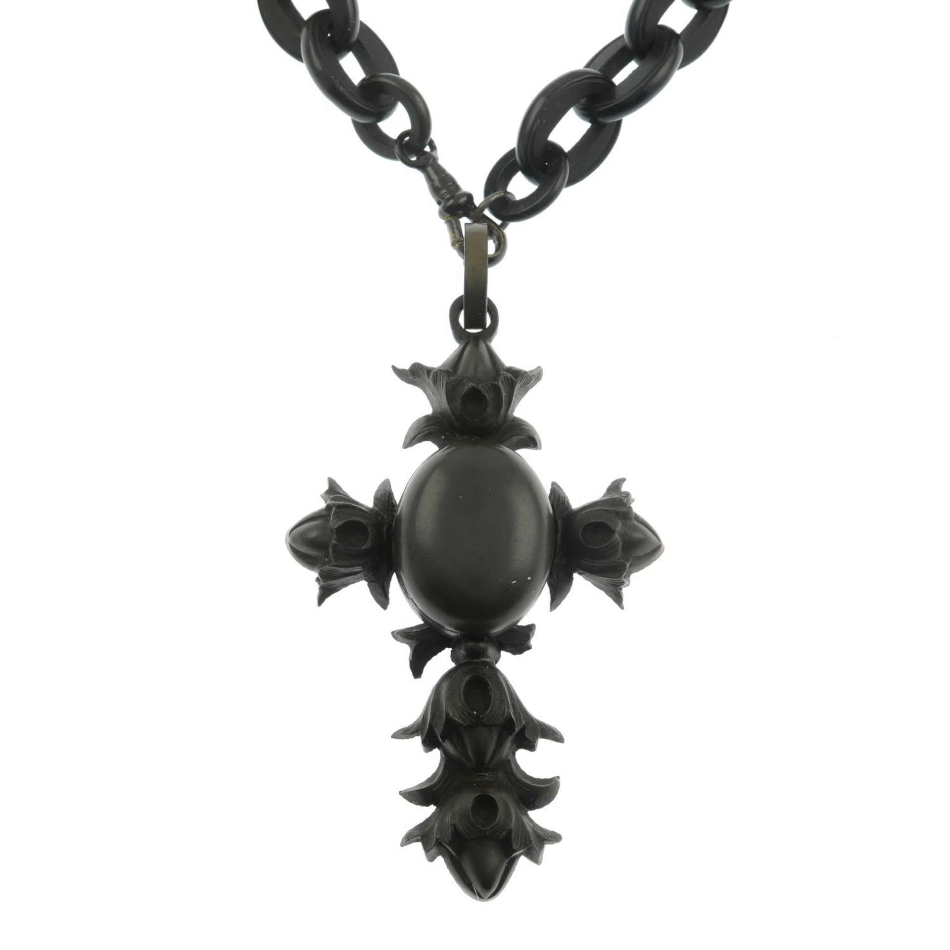 A Victorian vulcanite cross pendant and graduated chain necklace.Length of chain 54cms.